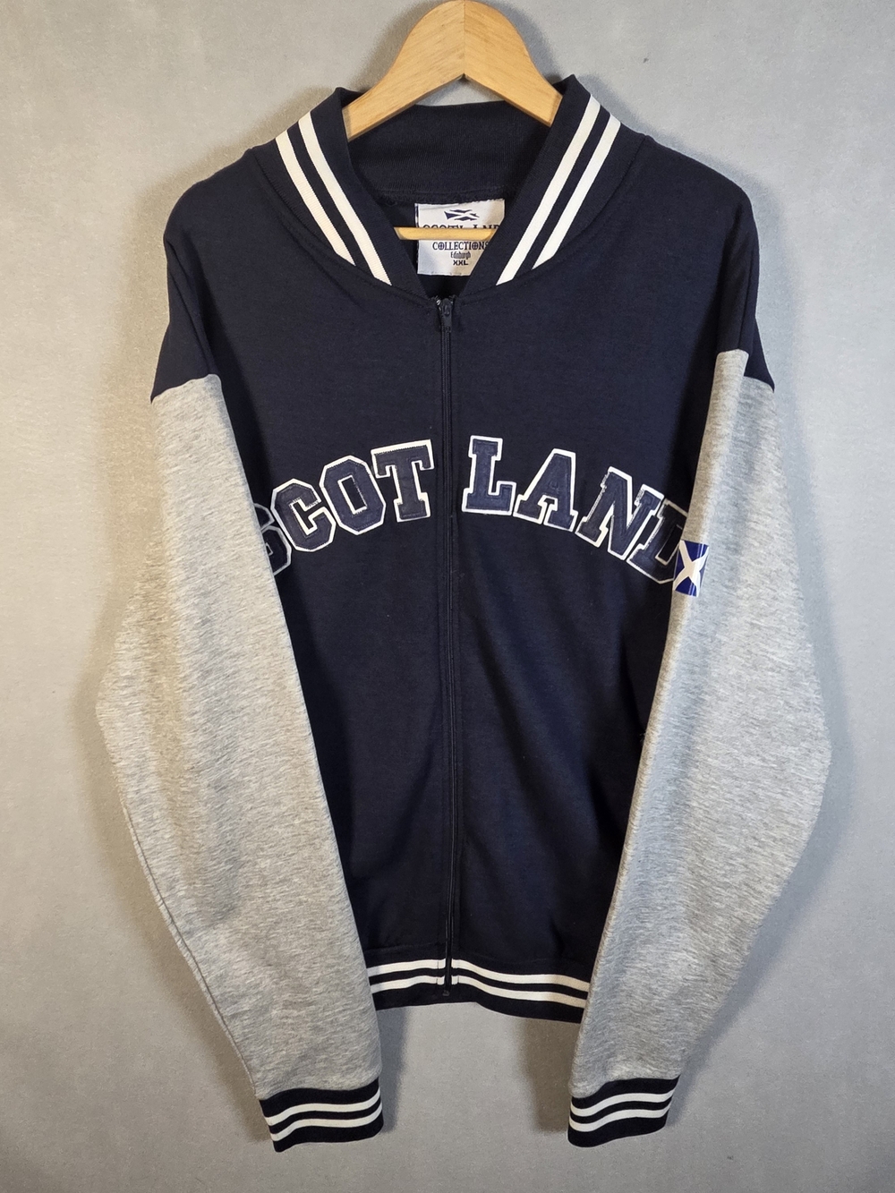 Full-zip varsity jacket featuring a "SCOTLAND" applique on the chest